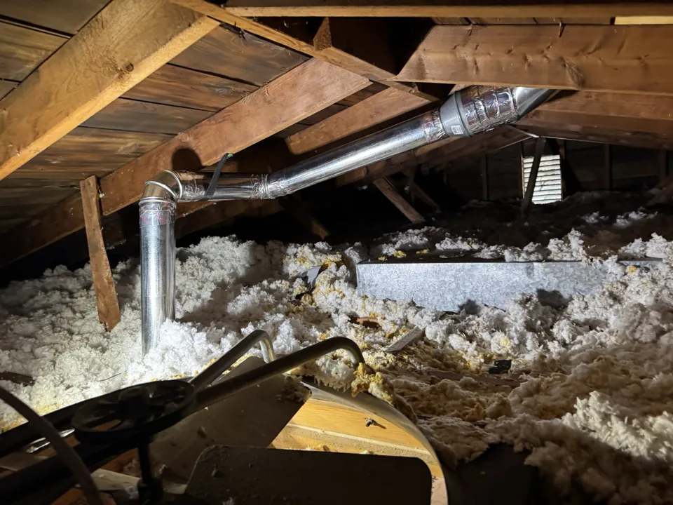 Rigid ductwork routed through the attic.