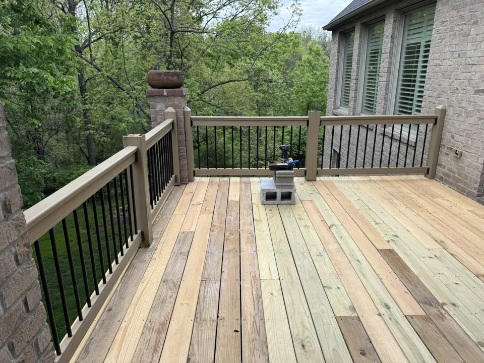 The renewed upper deck with contrasting dark balusters.