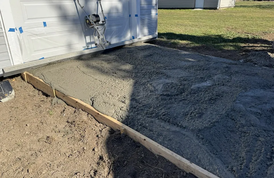 Concrete placed within forms at the garage entrance.