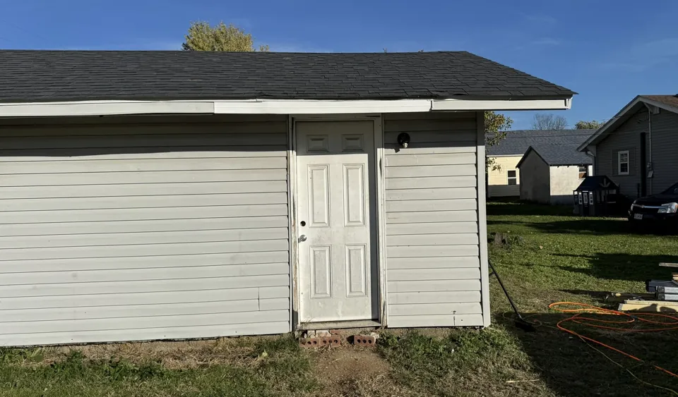 The side entry, siding, and trim in November.